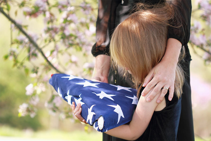 little-girl-and-mother-holding-American-flag