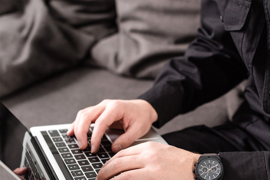 police-officer-typing-on-laptop